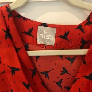 Red dress with navy bird silhouette motif